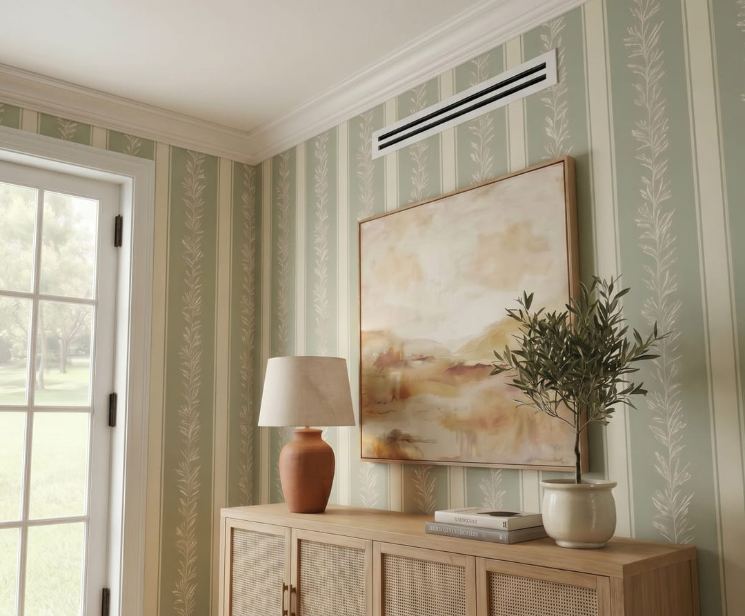 A linear slot diffuser on a living room wall.