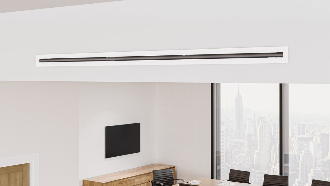 Close up of a linear slot diffuser in an office soffit.
